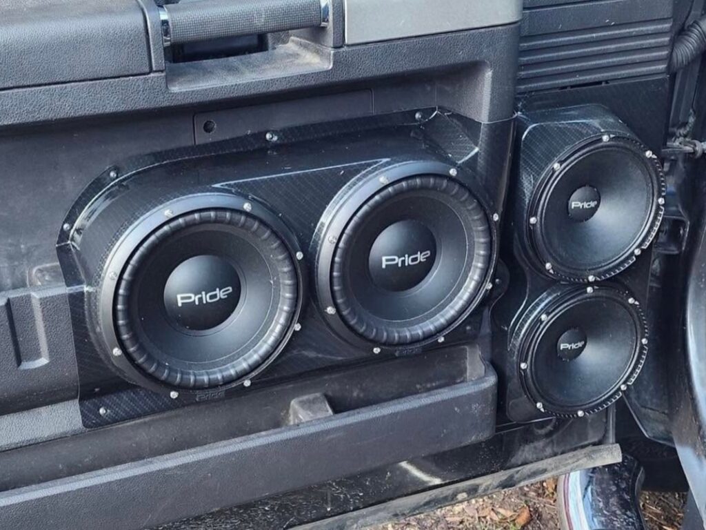 dual 6.5 inch and dual 8 inch speaker pods installed on a ford f250 door panel